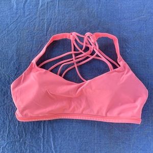 Coral pink strappy Lululemon padded sports bra